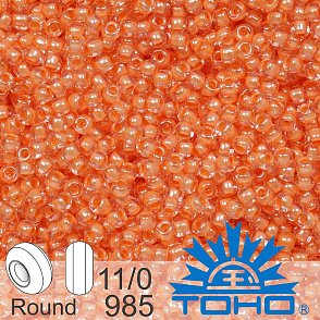 Korálky TOHO tvar ROUND (kulaté). Velikost 11/0. Barva č. 985-Inside-Color Crystal/Salmon Lined . Balení 8g.